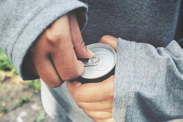 Cola can with hands — Stock Photo, Image