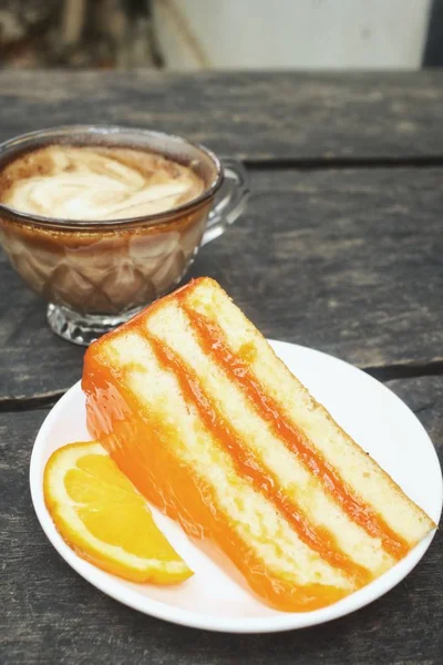 Orange cake with coffee cup — Stock Photo, Image