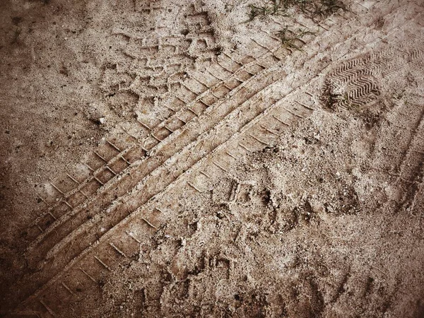 Wheel tracks on the soil — Stock Photo, Image