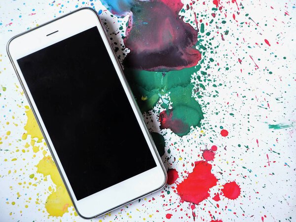 Smart phone on watercolor background