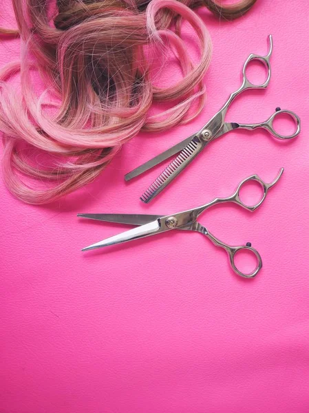 Hair cutting shears on pink background — Stock Photo, Image