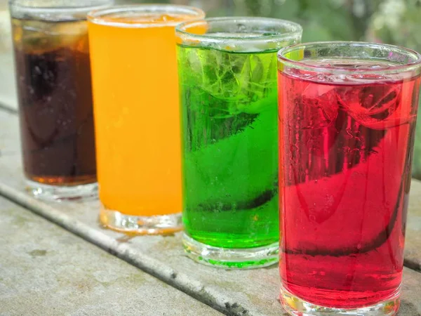 Close Shot Row Glasses Colorful Drinks Rustic Wooden Tabletop — Stock Photo, Image