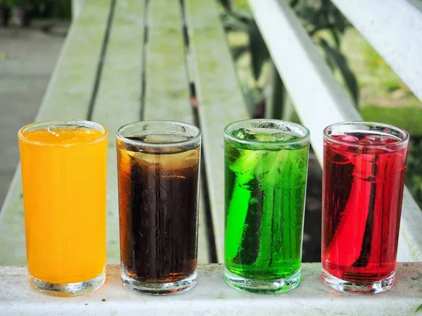 Row Glasses Colorful Drinks Wooden Table — Stock Photo, Image