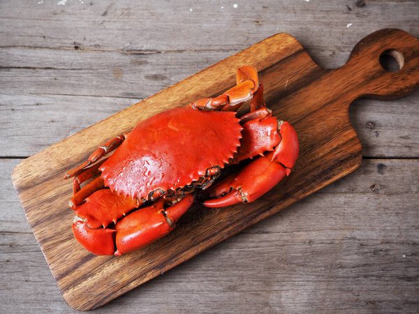 top view of delicious red fresh carb on wooden cutting board 