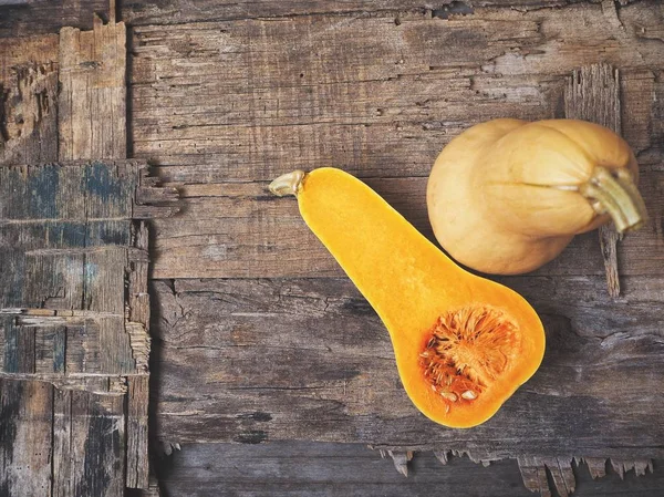 Cutted Ripe Yellow Butternut Squashes Old Wooden Background — Stock Photo, Image
