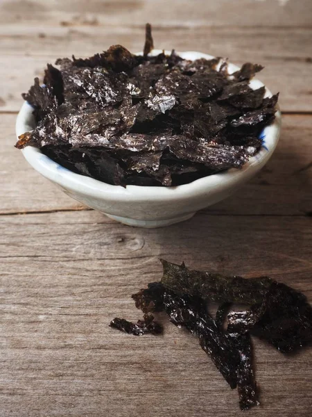 Bowl of Korean seaweed on wooden background