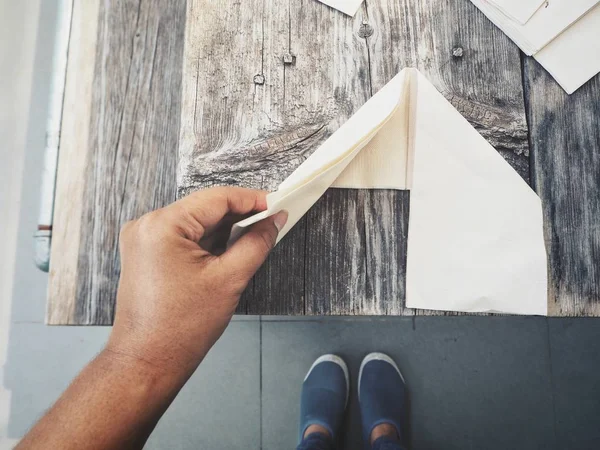 Man Putting Paper Napkins Wooden Table — Stock Photo, Image