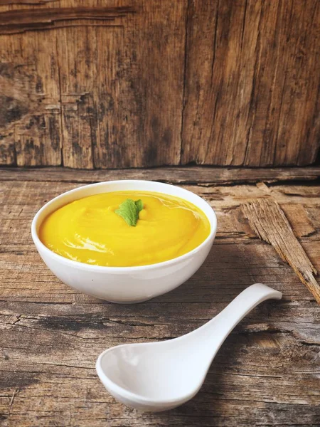 Soup pumpkin with a spoon — Stock Photo, Image