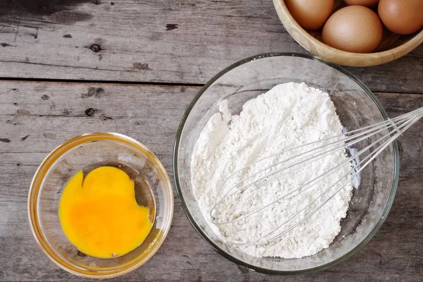 Baking ingredients with  yolk eggs and flour — Stock Photo, Image