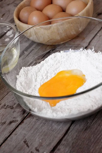 Baking ingredients with  yolk eggs and flour — Stock Photo, Image