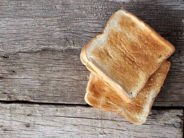 Fetta Pane Tostato Sfondo Legno — Foto Stock