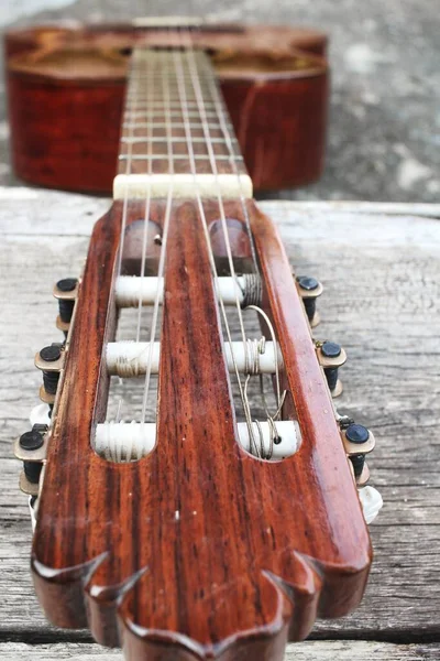 Guitar on gray wood background