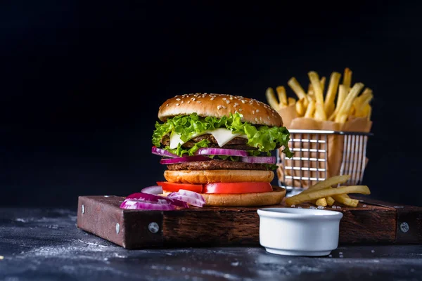 Hamburger on a black background — Stock Photo, Image