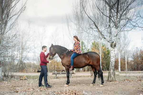 Wedding couple with a horse