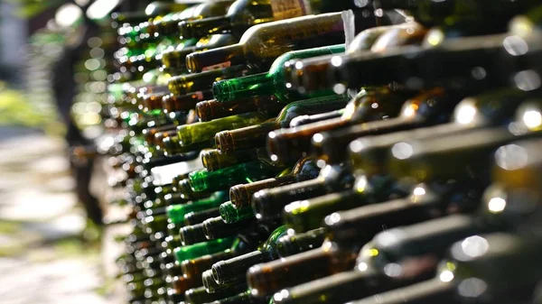 close up dirty empty wine bottles background