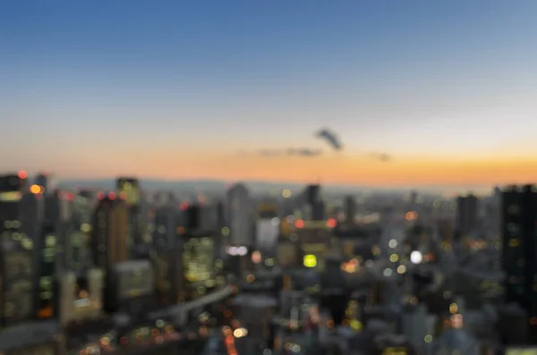 Vista de iluminación del crepúsculo aéreo del centro de la ciudad desenfoque bac —  Fotos de Stock