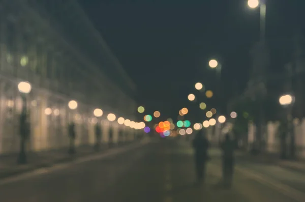 Blurred image of people walking through a city street with empty — Stock Photo, Image