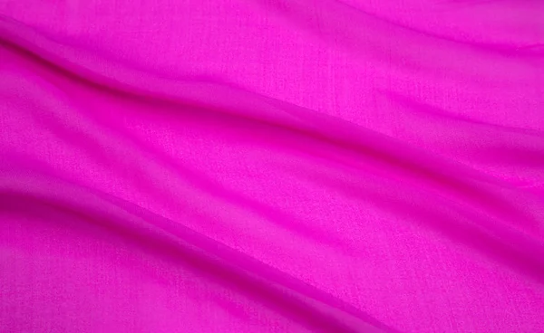 Tecido de luz rosa dobrado — Fotografia de Stock