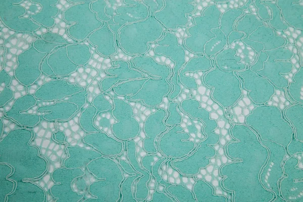 Guipure tissu dentelle sur fond blanc couleur turquoise — Photo