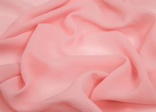 Tecido rosa claro forrado com dobras macias — Fotografia de Stock