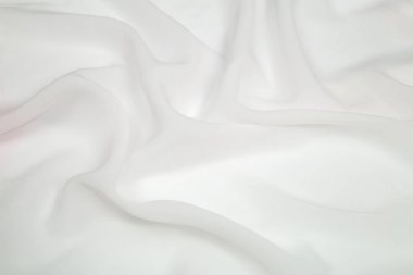 parlak beyaz kareyi hafif kumaş yumuşak kıvrımlar masanın üzerine yayılmış