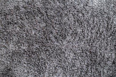 Koyu gri yumuşak bir halı deseni. Pürüzsüz, düz tabanlı.