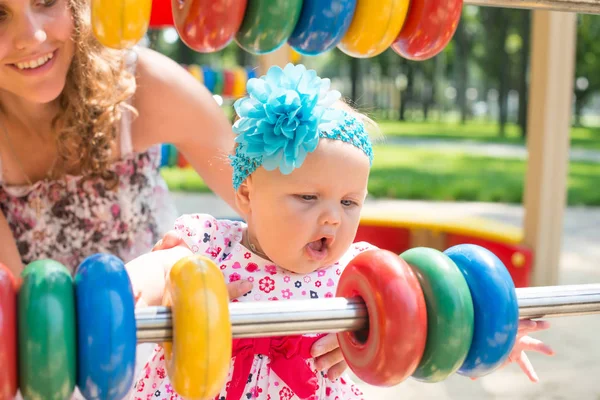 Happy child girl riding train on funfair on summer vacation — Stock Photo, Image