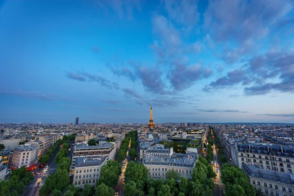 Skyline of Paris with Champs-Elysees and Eiffel tower at sunset — Stock Photo, Image