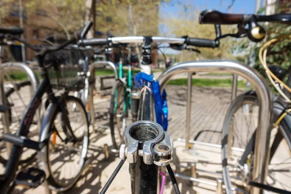 Old bicycles in a parking without saddle — Stock Photo, Image