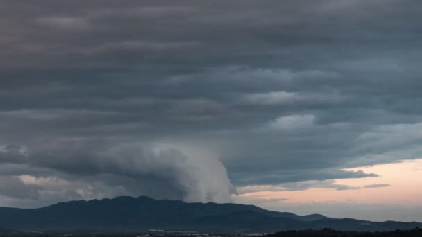 Spectacular clouds slithering over mountain range time lapse — Stock Video