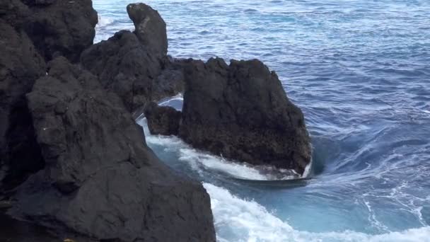 Eddy in super slow motion with volcanic rocks — Stock Video