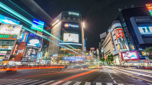 Tokyo, Japan. May 30, 2015. The shibuya district in Tokyo with blurred traffic. Shibuya is popular in Tokyo for his pedestrian cross where pedestrians cross in the same moment from all directions.