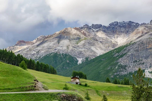 Dolomite rock mountains at dusk with houses