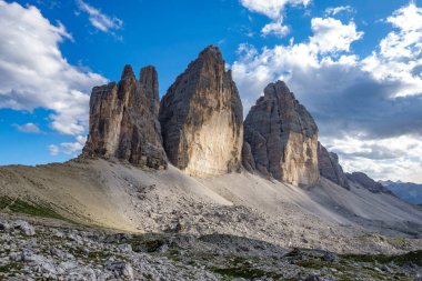 Tre Cime di Lavaredo against cloudy blue sky