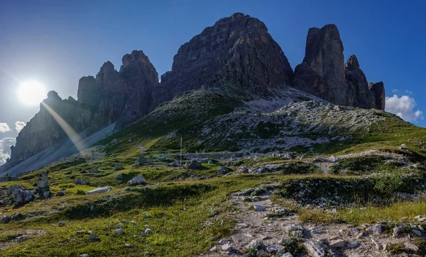 Tre Cime di Lavaredo rocks backlit at sunset — Stock Photo, Image