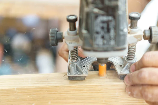 Blurred motion of carpenter working preparing door for hinges — Stock Photo, Image