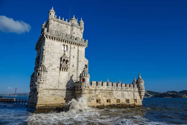 Lisbon Torre de Belem, high tide with wave breaking — Stock Photo, Image