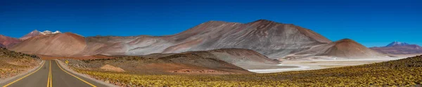 Super wide panorama of red stones and road — Stock Photo, Image