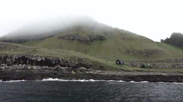 Faroe islands coastline with typical houses in slow-mo — стокове відео