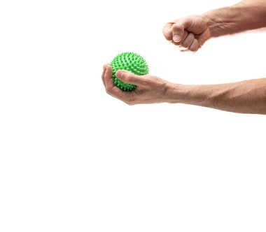 Hand holding sphere with spines while right fist crushes it against white clipart