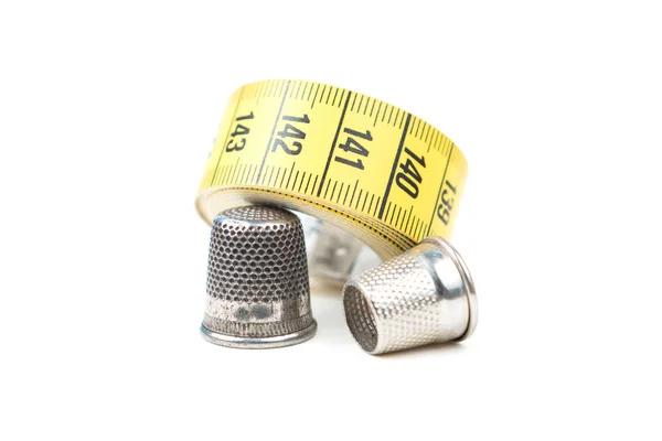 Two Metal Silver Sewing Thimble Yellow Measuring Tape White Background — Stock Photo, Image