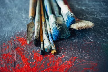 set of brushes on a colorful colorful background with red blots clipart