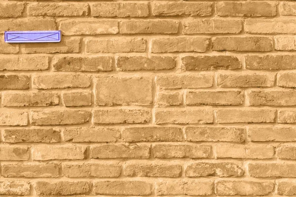 Wallpaper of an antique sepia brick wall — Stock Photo, Image