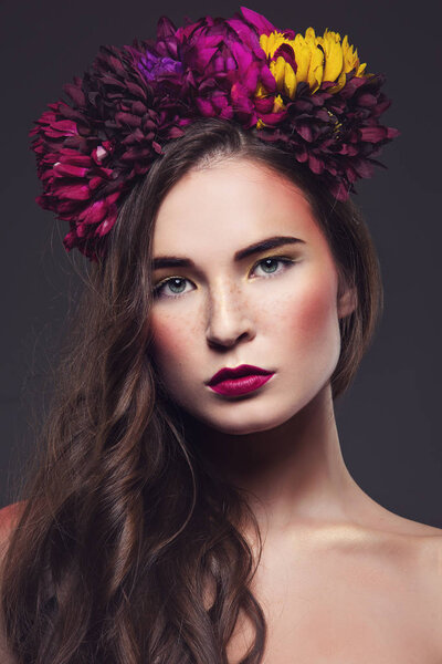 Beautiful girl with flowers on head