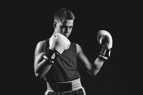 Young boxer sportsman on black background — Stock Photo, Image