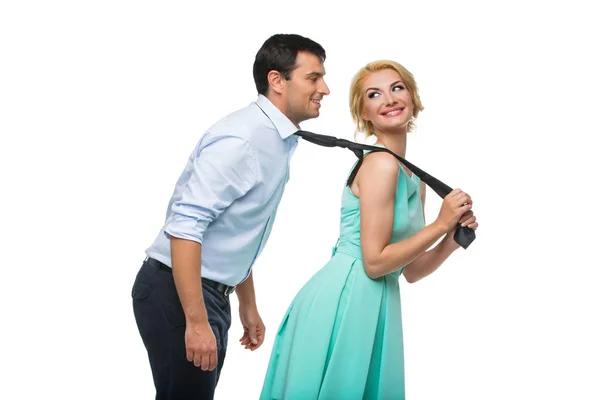 Woman pulling man for his tie — Stock Photo, Image