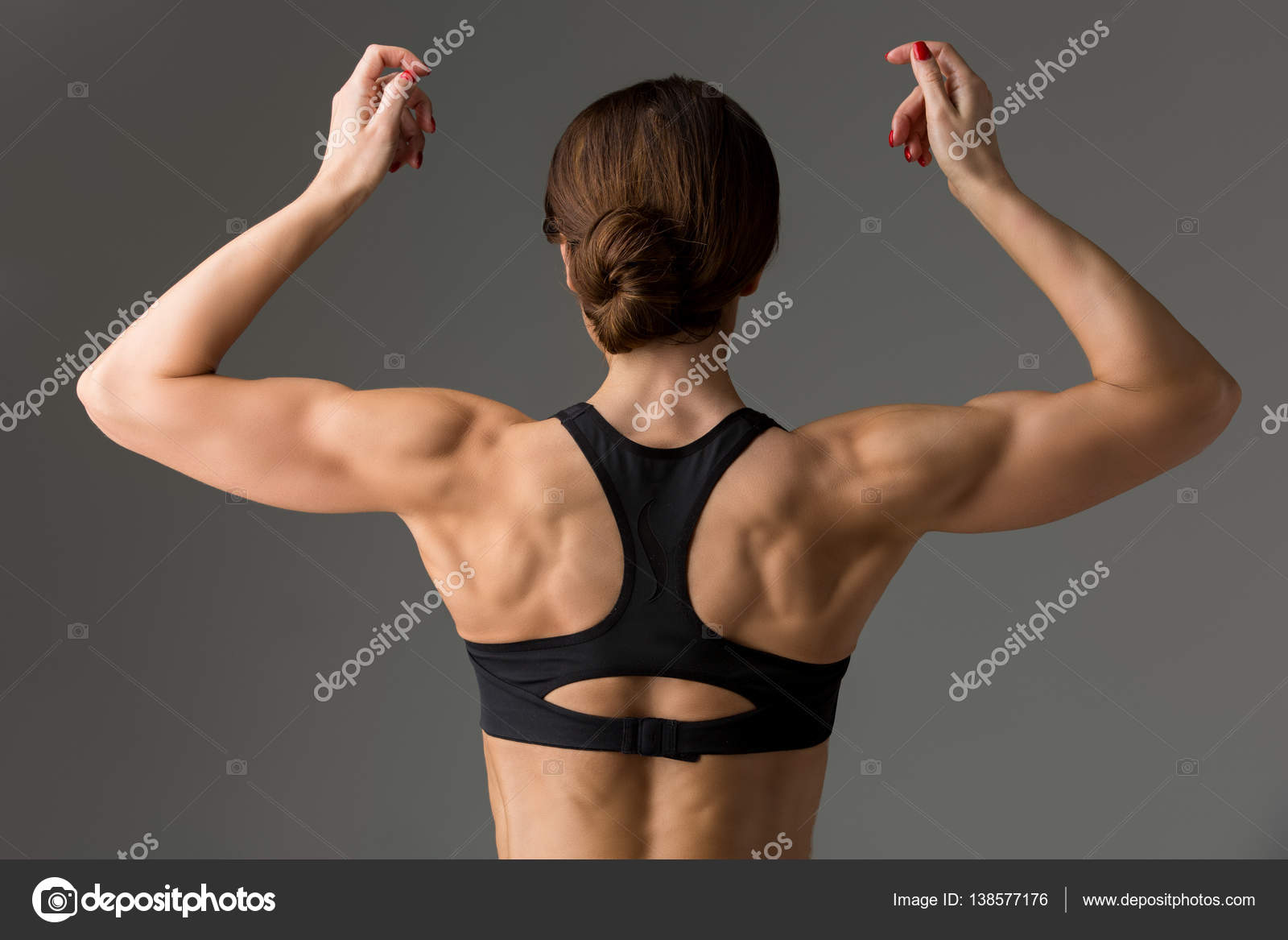 Sporty girl back with muscles Stock Photo by ©Svetography 138577176