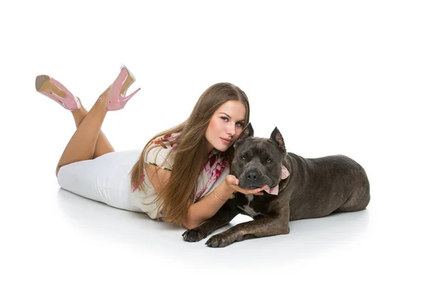 Beautiful girl with grey stafford terrier — Stock Photo, Image