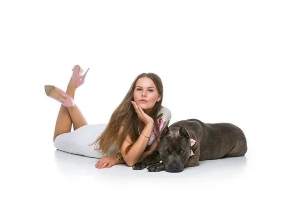 Beautiful girl with grey stafford terrier — Stock Photo, Image