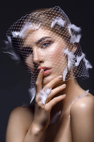 Beautiful girl in veil with feathers — Stock Photo, Image